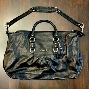 Coach purse.  Black outside and purple inside.  Like new!